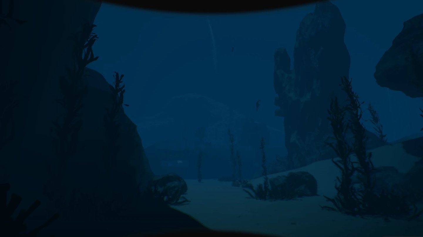 Open water over a sandy seabed, with kelp and rock spires.
